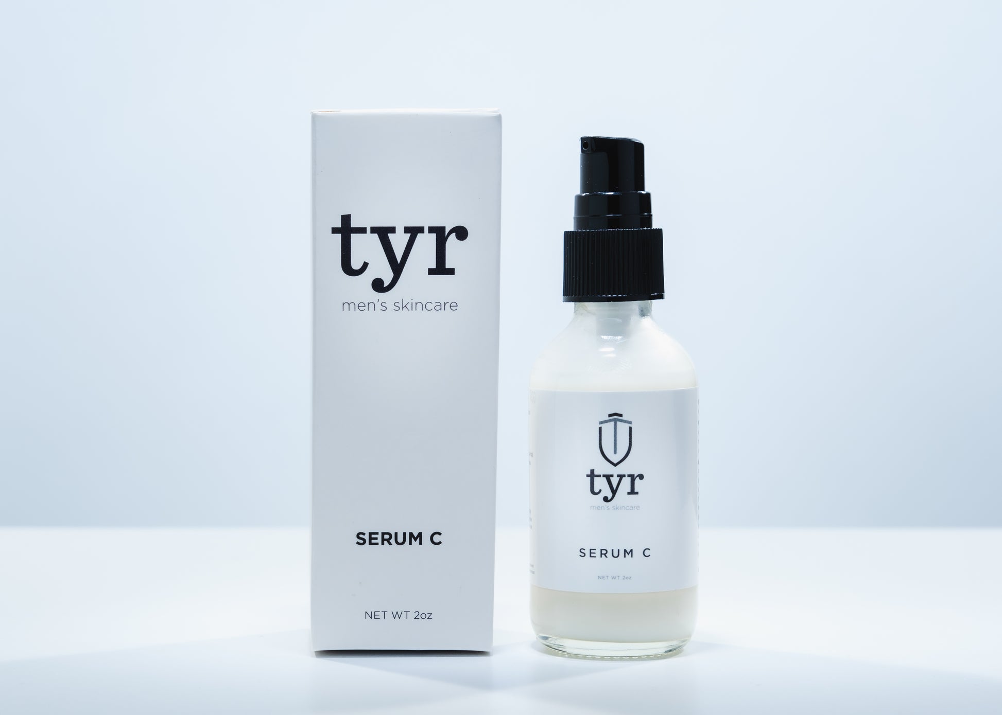 Tyr Skincare for men vitamin C serum with packaging box isolated in white background, close up straight on angle